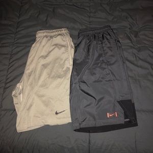 2 pair of gray Nike shorts.